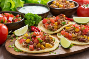 Mexican cuisine - tortillas with chili con carne and tomato sals