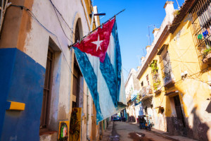 Street in Old Havana with a cuban flag