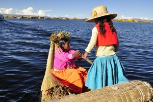 bolivia girls in boat on lake